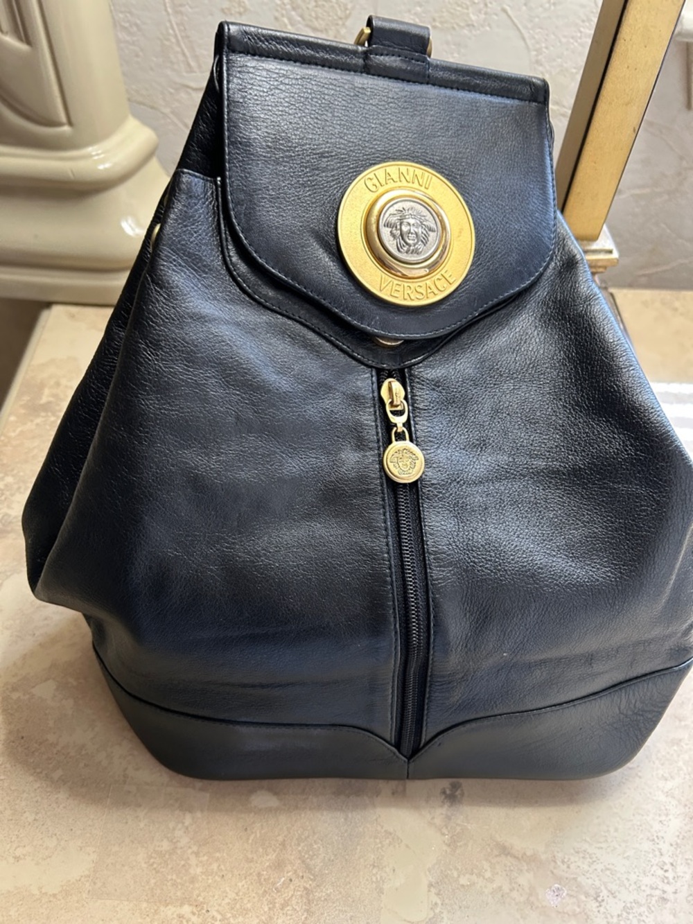 Versace Black Leather Backpack with Gold Medallion Accent one shoulder backpack